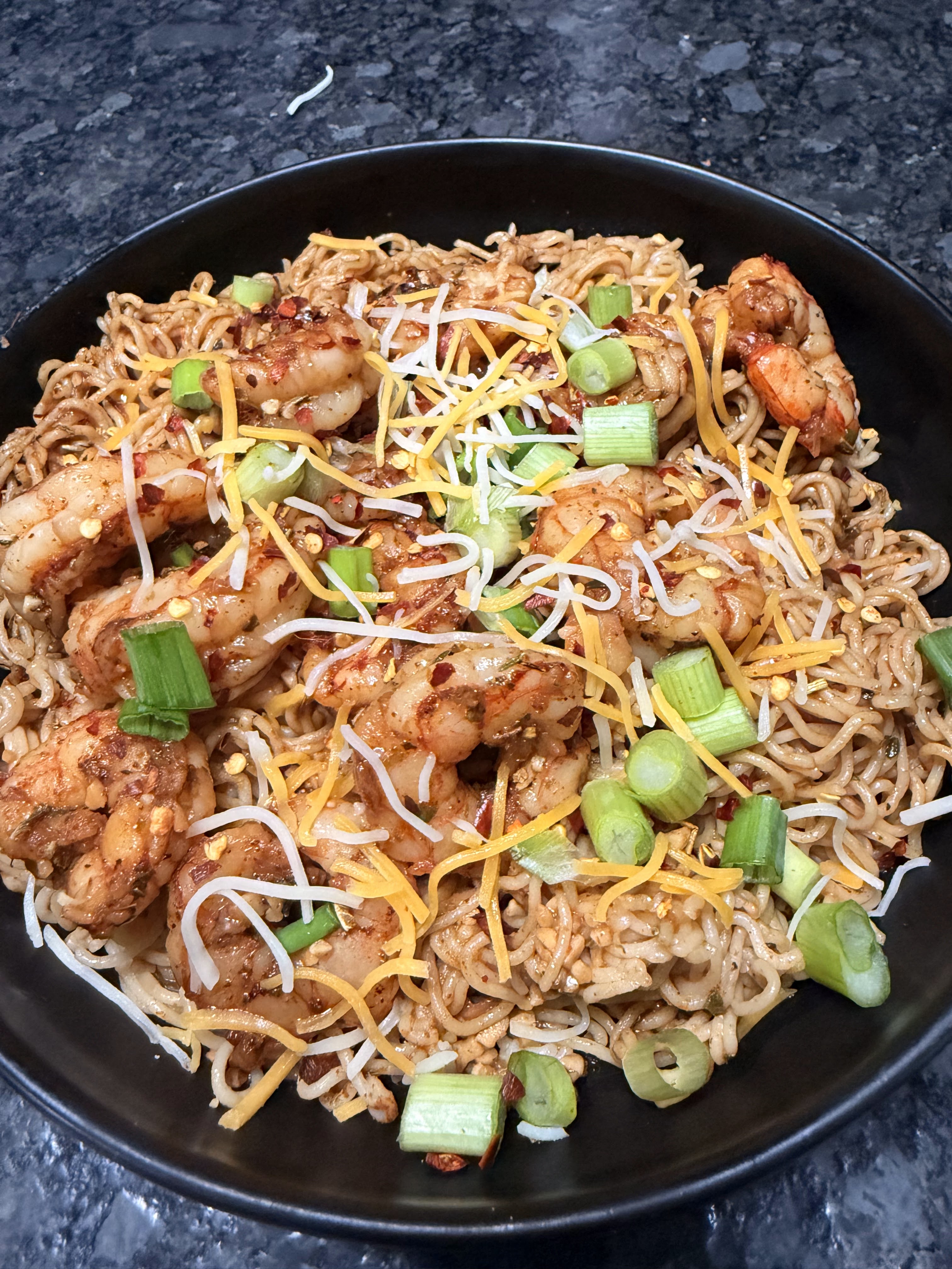 Seasoned shrimp and noodles finished with green onions