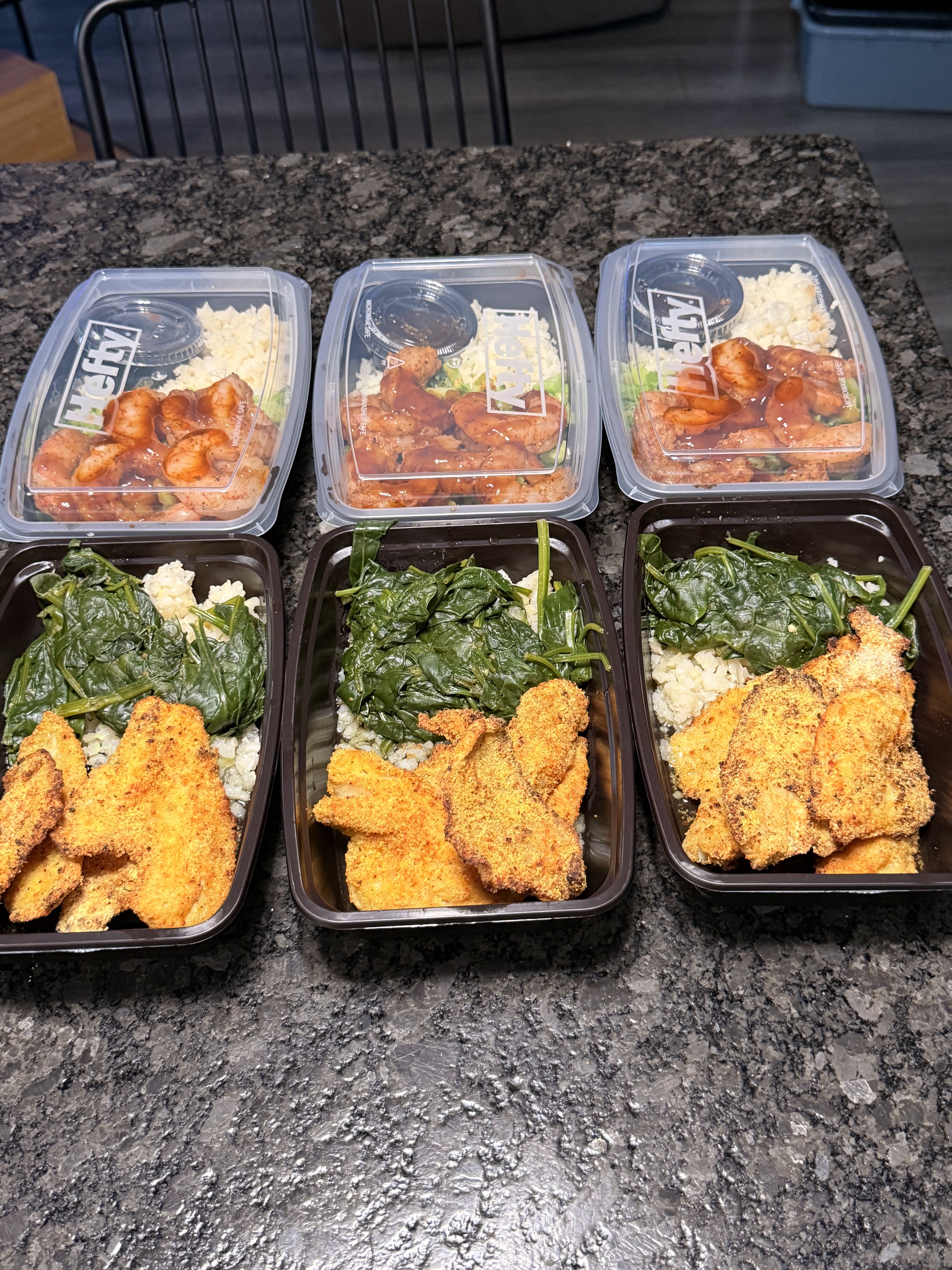Clean Vibez meal prep containers arranged for packing