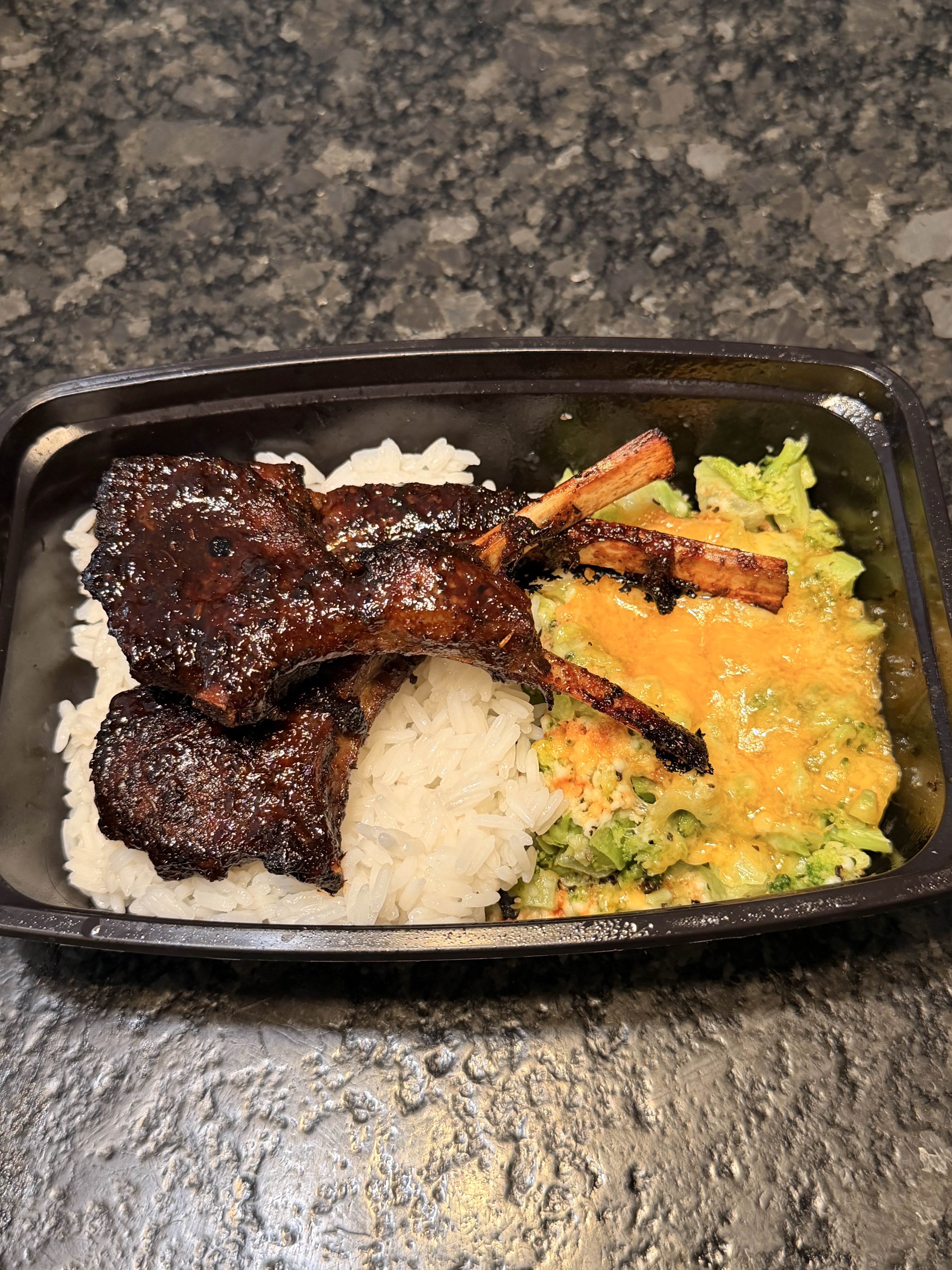 Glazed lamb chops with rice and broccoli in a meal prep container