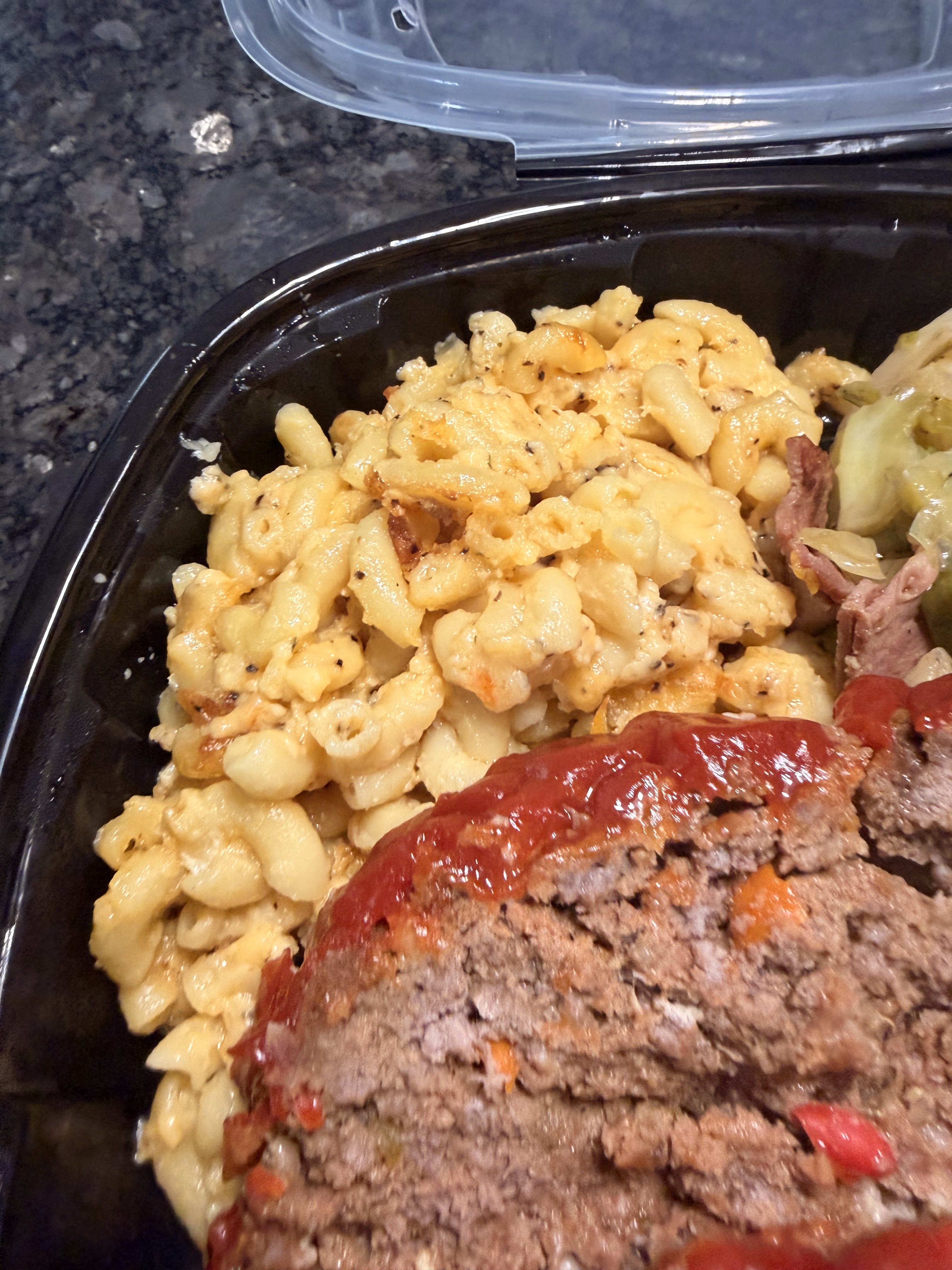 Meatloaf served with creamy macaroni and cabbage