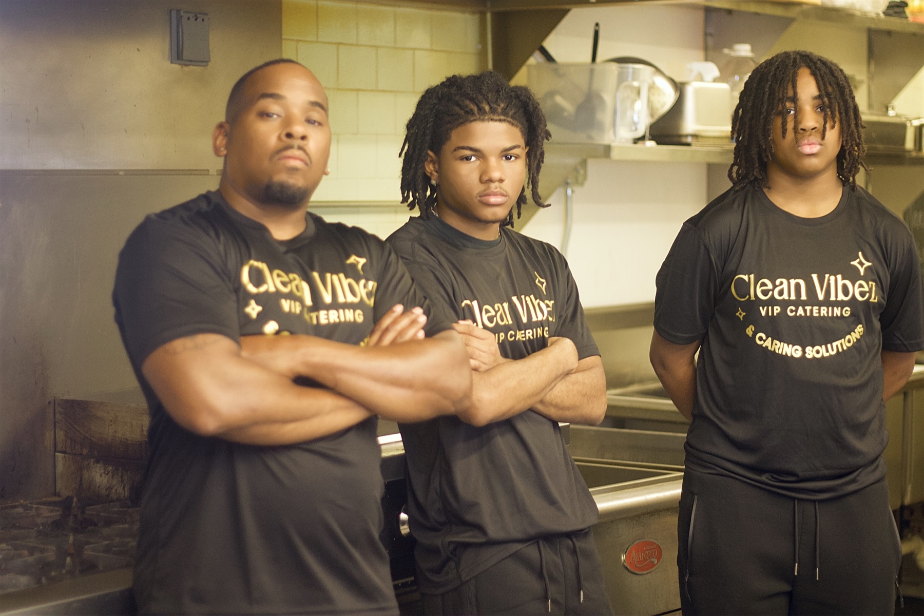 Three members of the Clean Vibez team in the kitchen