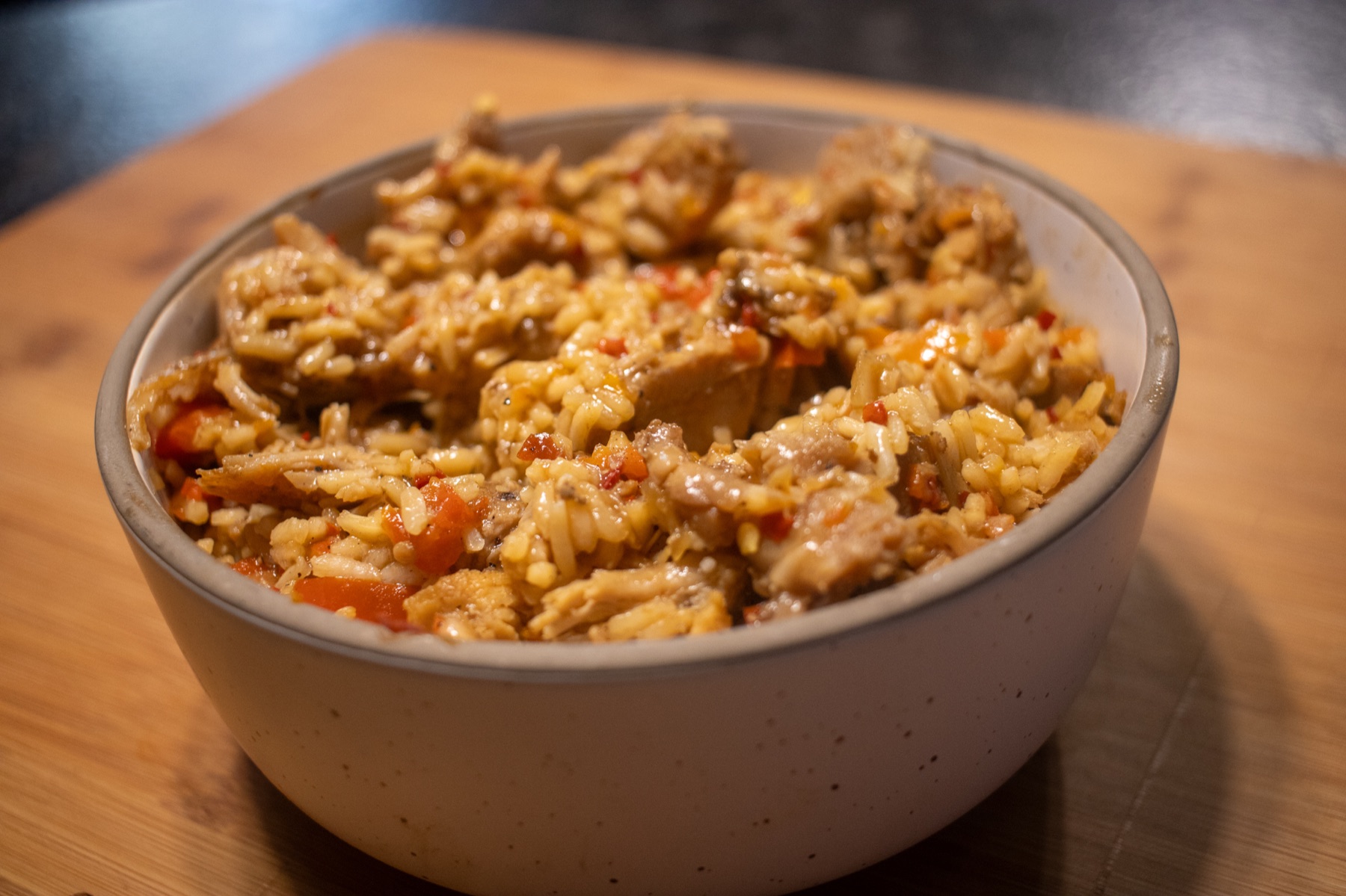 Bowl of seasoned chicken and rice prepared by Clean Vibez